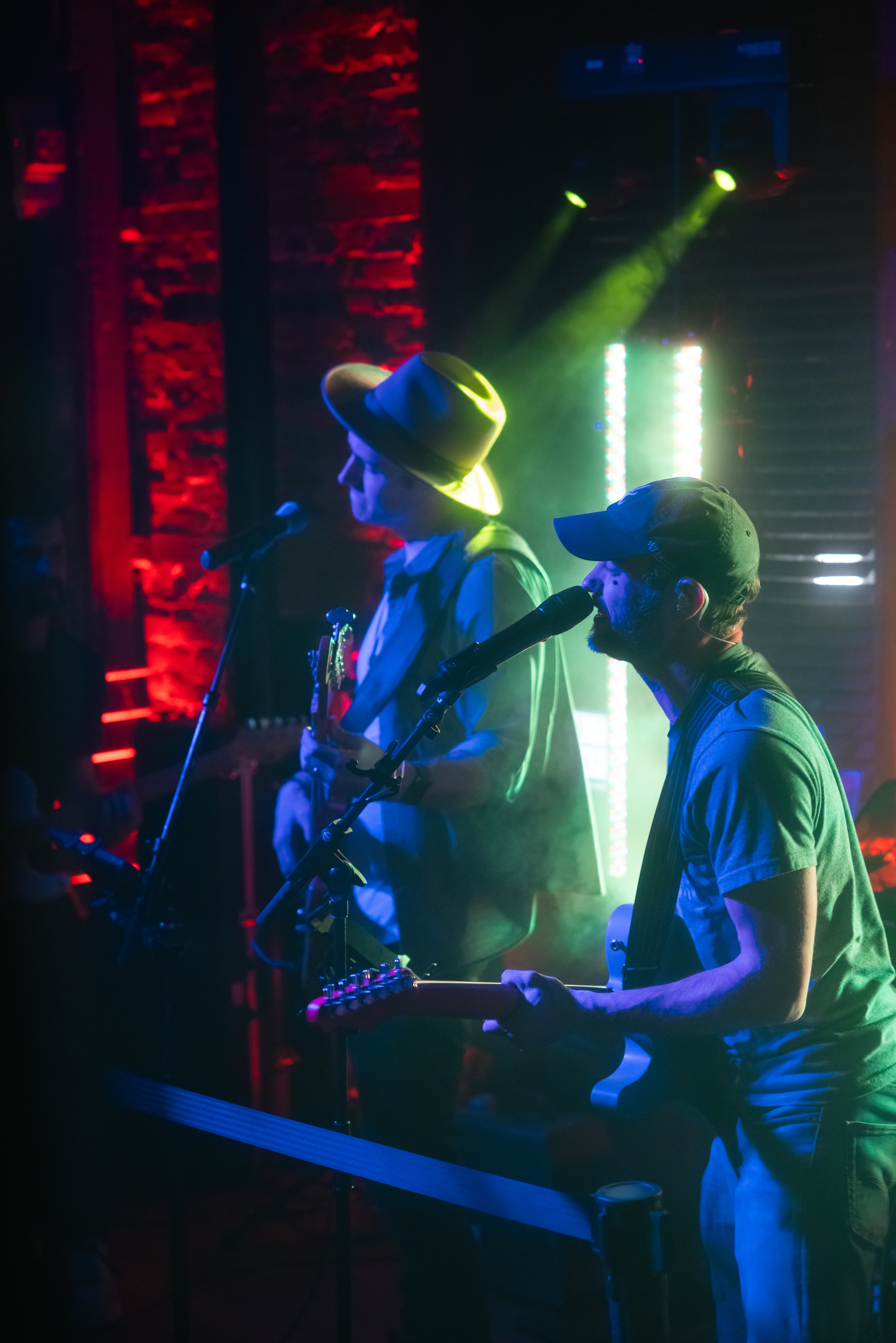 Rob and Zach performing at a bar