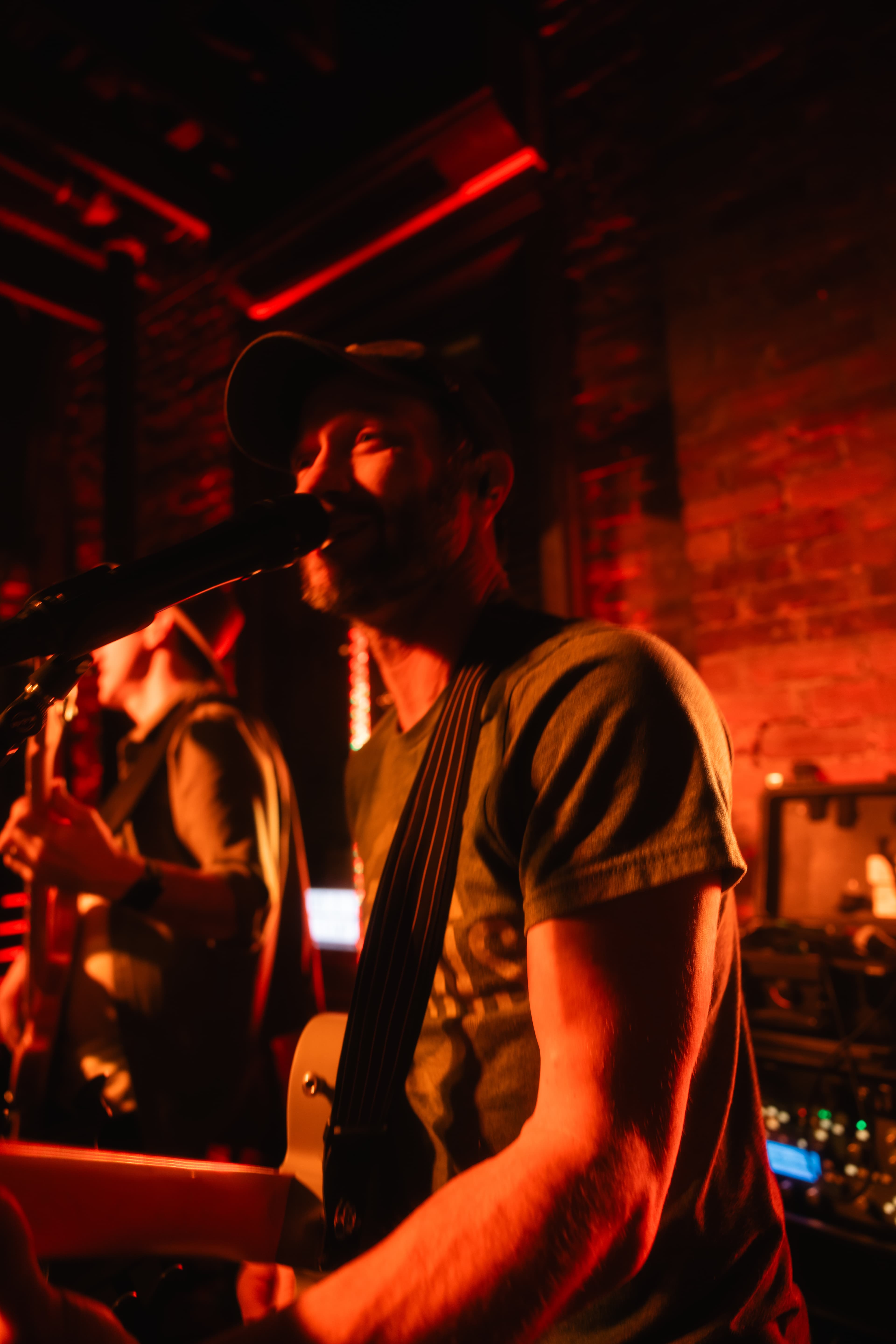 Rob performing at a bar