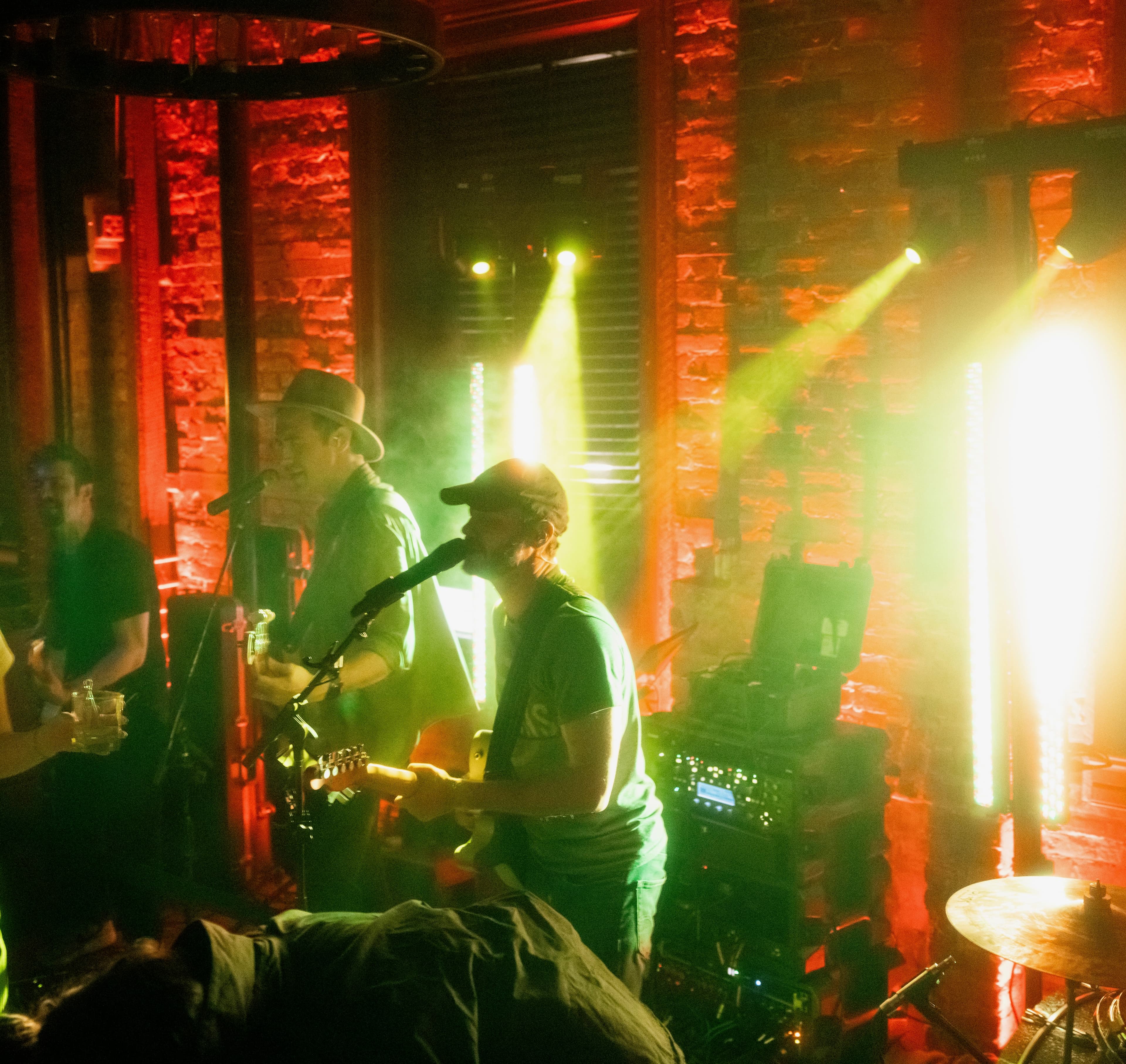 Wide shot of the band at a bar venue