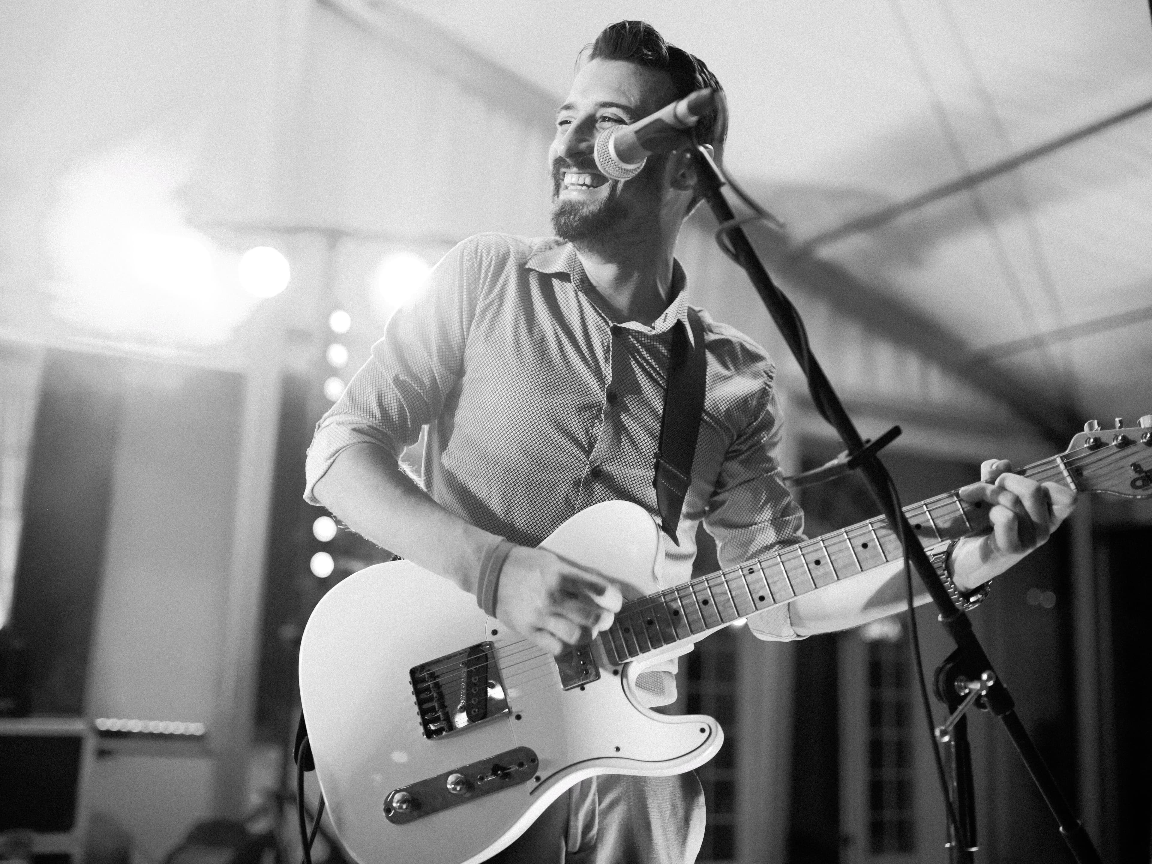 Black and white portrait of Danny smiling