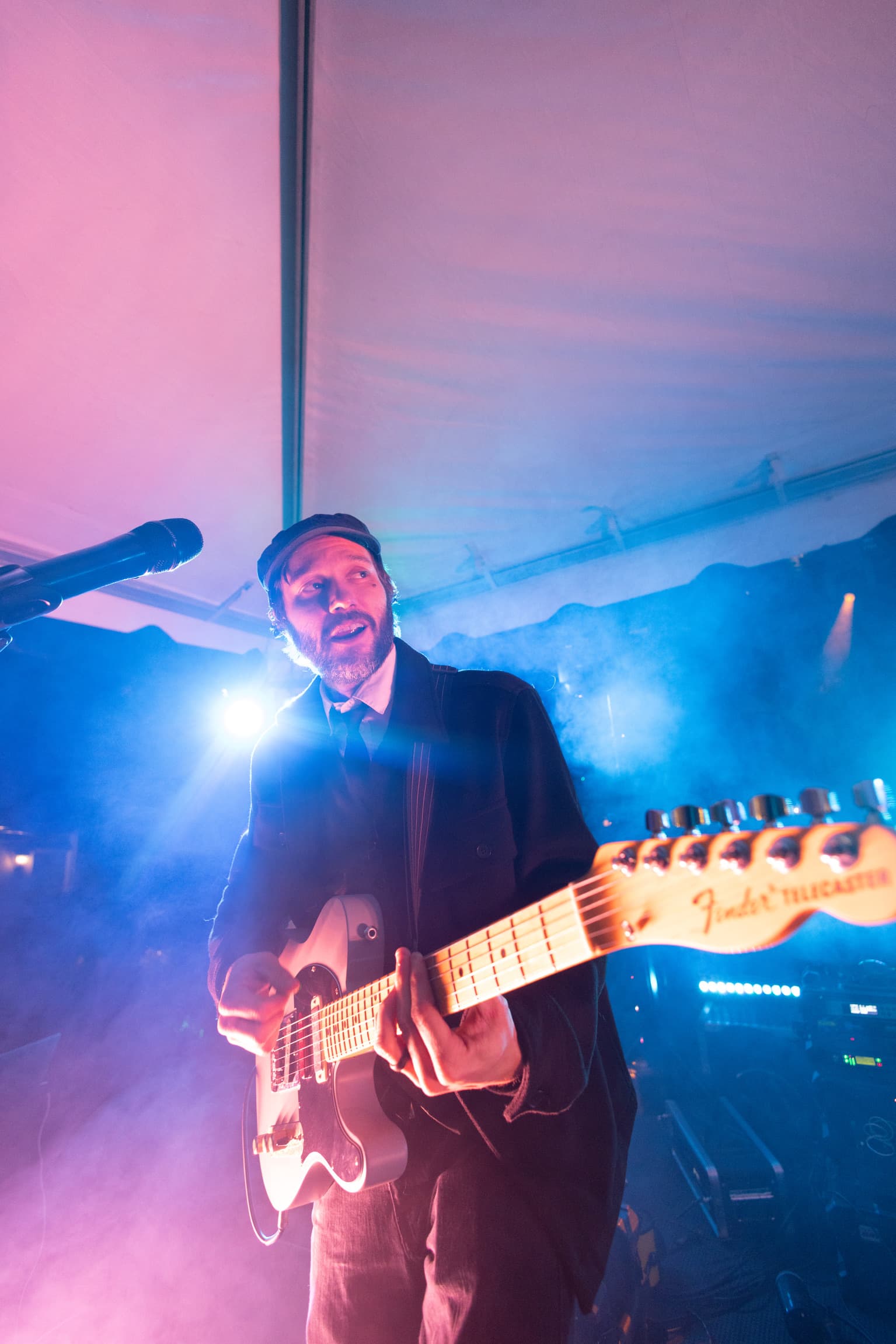 Rob playing guitar during a performance